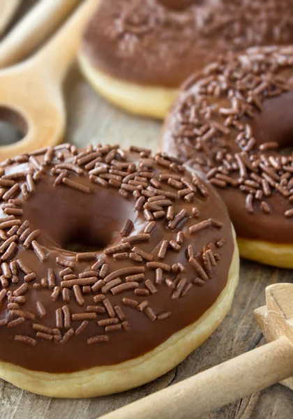 Baking chocolate donuts close up