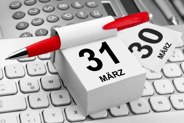 German business calendar March 31 and PC keyboard close u
