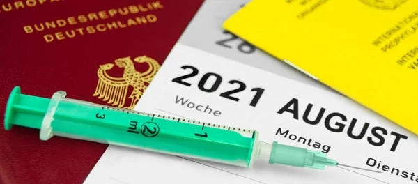 German Passport and Vaccination Certificate with injection August 2021