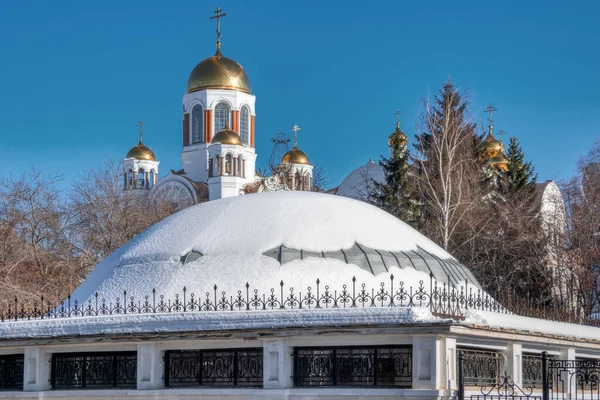 domes of churches. the golden domes are covered with snow. winter sunny day, openwork details
