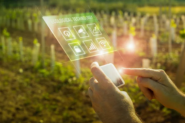 Person with mobile in nature using advanced technology