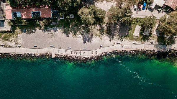 Aerial view of group of people riding bicycles in Kotor bay (Boka Kotorska), Montenegro, Europe