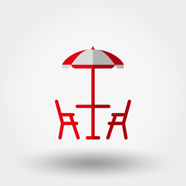 Beach table under an umbrella and chairs.