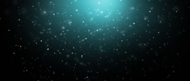 Christmas background. Snow particles on a dark background with a turquoise glow.