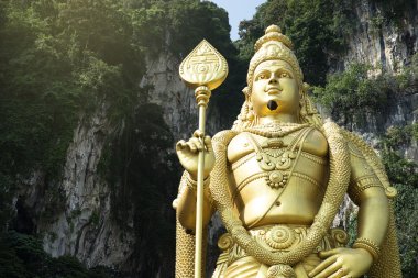 Statue of hindu god Muragan at Batu caves. clipart