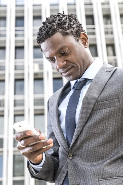 Handsome african american businessman reading email on smart pho — Stock Photo, Image