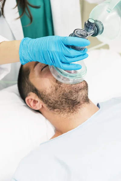 Doctor using the ball resuscitation with a patient — Stock Photo, Image