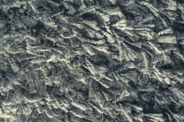 Uzun saç halısının deseni koyu mavi, kürk deseni tasarımcılar için yakın plan.