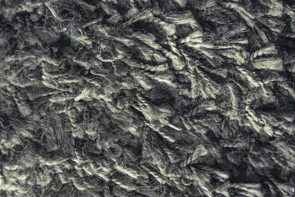 Uzun saç halısının deseni koyu mavi, kürk deseni tasarımcılar için yakın plan.