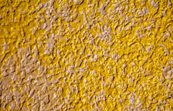 Abstract grainy texture on yellow and white wall. It can be used as a design elements and background
