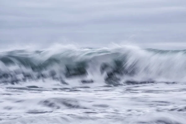 waves crashing on the water surface of the river. the wave and a large sea in the rain.