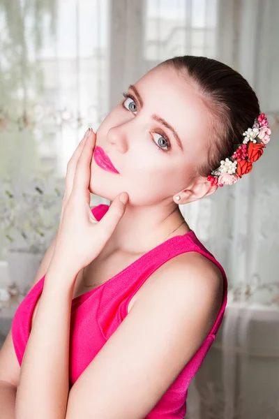 Portrait of a beautiful blonde woman with flowers in her hair Stock Image