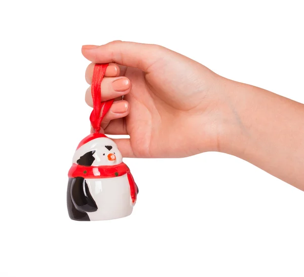白い背景の上のクリスマスのおもちゃと手します。 ロイヤリティフリーのストック画像