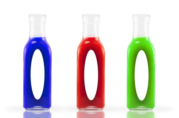 Beyaz arka planda üç renkli şişe.