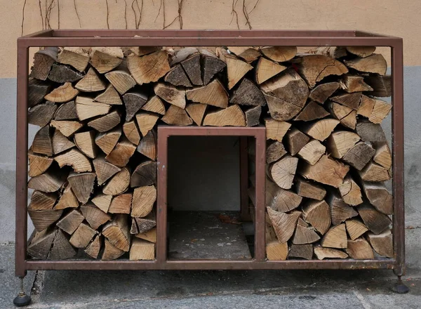 Outdoor wood holder in Bergamo alta, Lombardy, Italy.