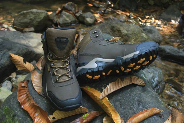 boots with a masculine design for outdoor adventure activities, with jagged soles suitable for tropical and snowy terrain.