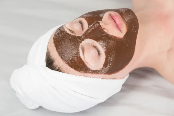 Woman chocolate face-pack