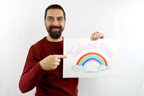 Young Bearded Man Smiling Holds Sign His Hand Inscription Spanish — Stock Photo, Image