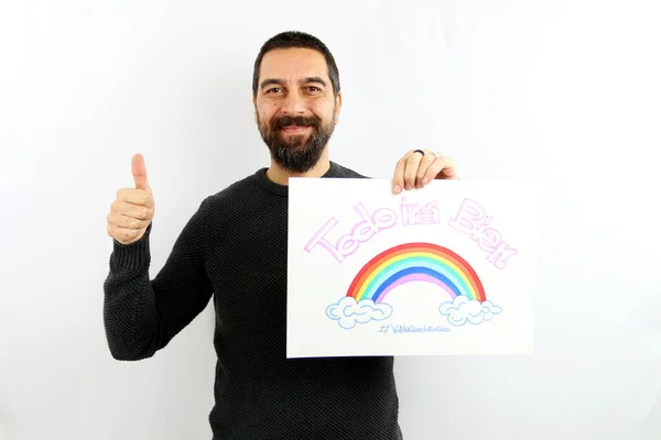 Young Man Beard Smiling Holds Sign His Hand Inscription Spanish — Stock Photo, Image