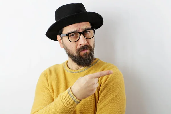 Bearded Man Wearing Hat Eyeglasses Pointing Aside Worried Nervous Forefinger — Stock Photo, Image