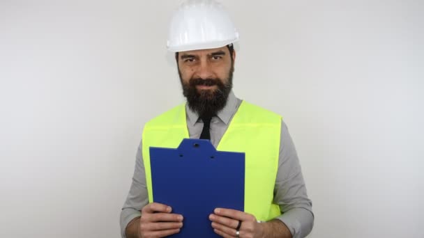 Engineer Beard Wearing Work Helmet Reflecting Jacket Holding Flip Board — Stock Video