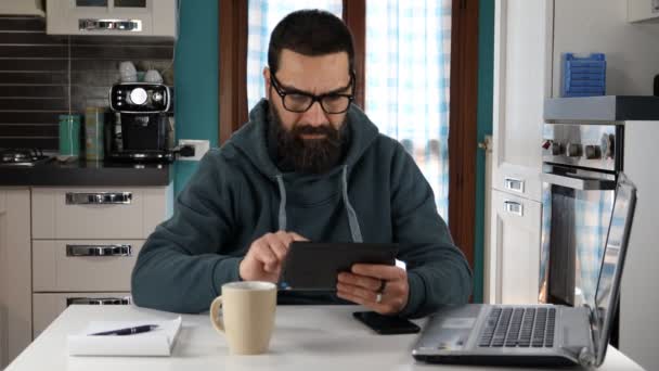 Man Beard Glasses Working Tablet Home Smiling Doing Sign Hand — Stockvideo