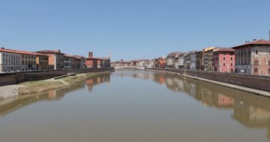 Timelapse, the Arno river and the Conte Ugolino bridge called Ponte di Mezzo seen from the Ponte della Fortezza in Pisa, Italy.