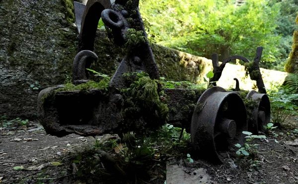 Old rusty mine cart in the ancient abandoned mines of Calferro. Archaeological Mines Park of Mulina di Stazzema, Tuscany, Italy.