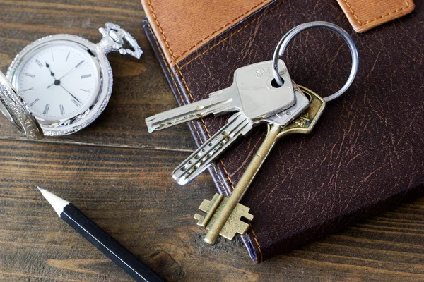 The keys to the doors at the diary and watch a top view Stock Picture