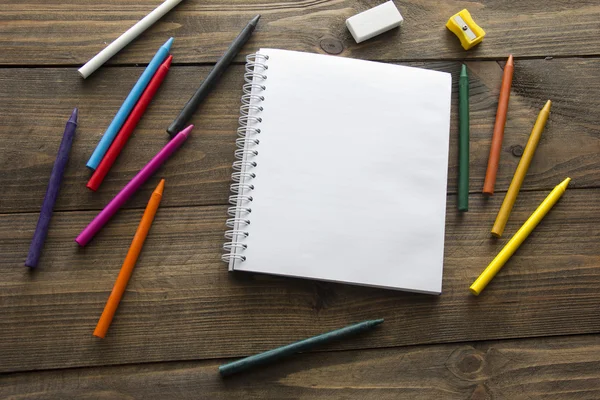 Colored pencils and notebook — Stock Photo, Image
