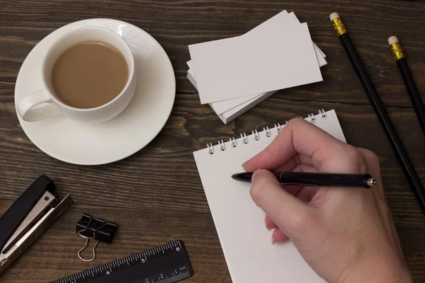 Coffee , notepad to take notes and hand — Stock Photo, Image