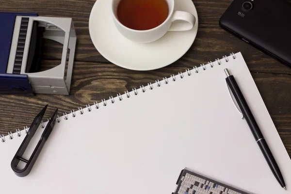 Stamp , tea, notebook and pen — Stock Photo, Image