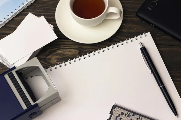 Stamp , tea, notebook and pen — Stock Photo, Image