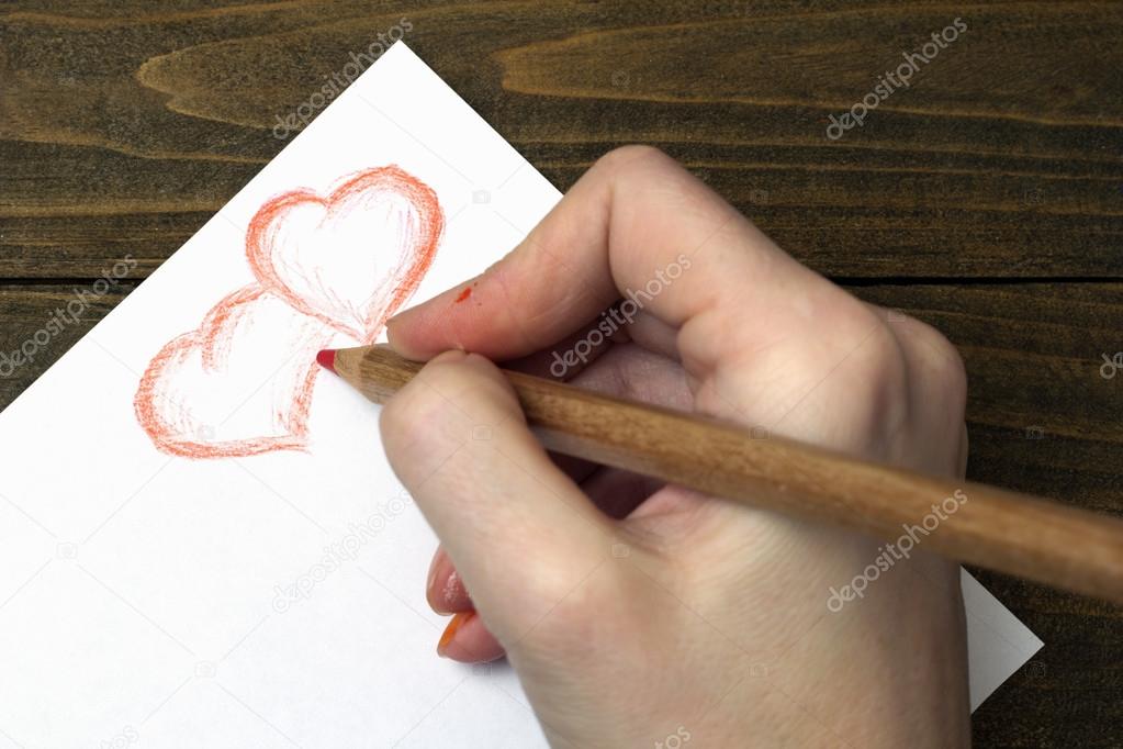 hand draws two hearts pencil 