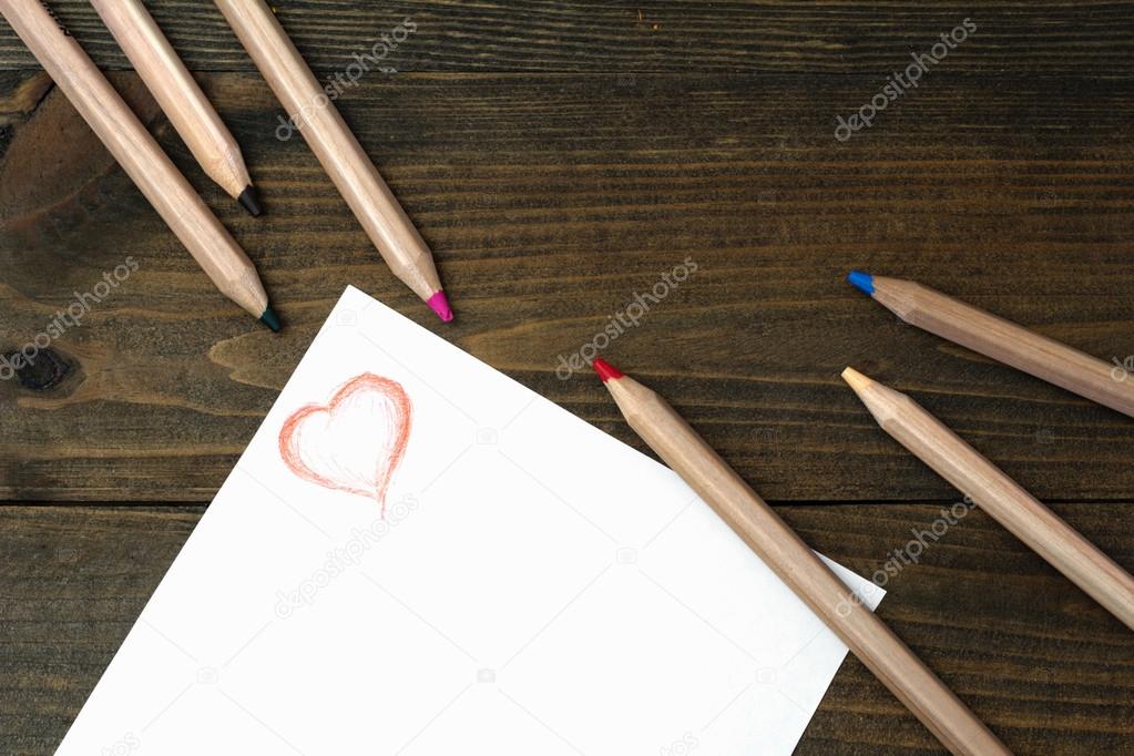 wooden pencils and red heart painted 