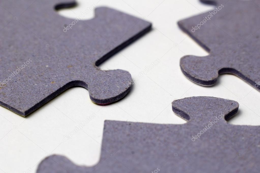 three puzzle pieces macro 