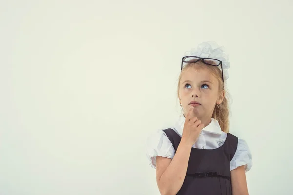 Schoolgirl thinking, isolated — Stock Photo, Image