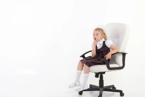 Schoolgirl sit on chair and ask to be quiet — Stock Photo, Image