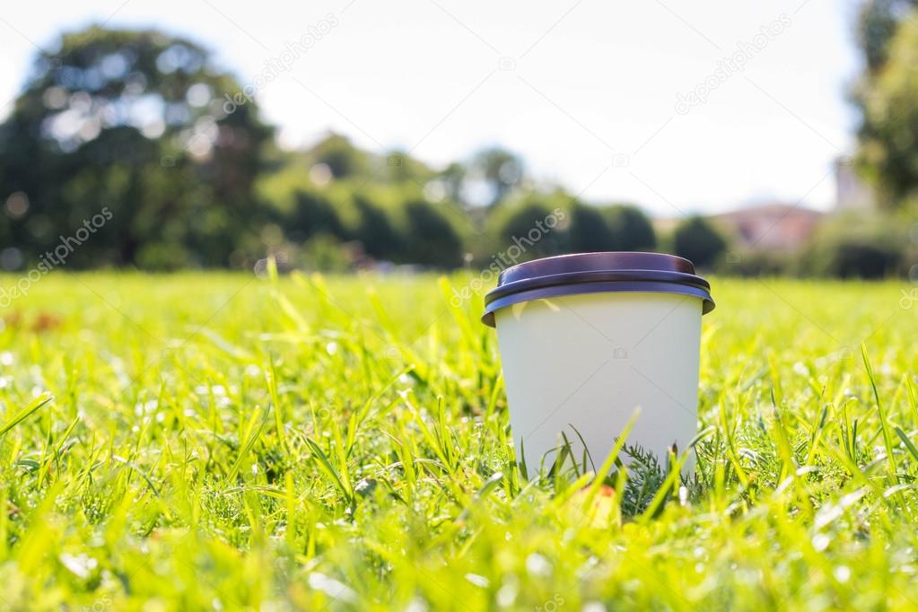 Coffee cup on grass