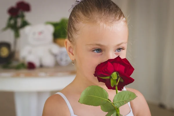 Portrait of little cute ballerina on swing with rose. Fairy-tail — Stock Photo, Image