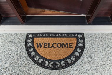Welcome door mat with open door clipart