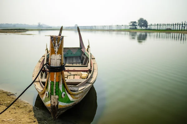Boat at at U Bein Bridge — стоковое фото