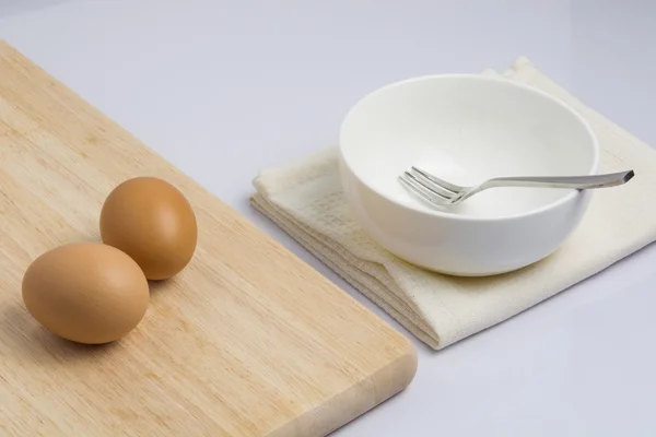 Raw eggs and cooking equipment — Stock Photo, Image