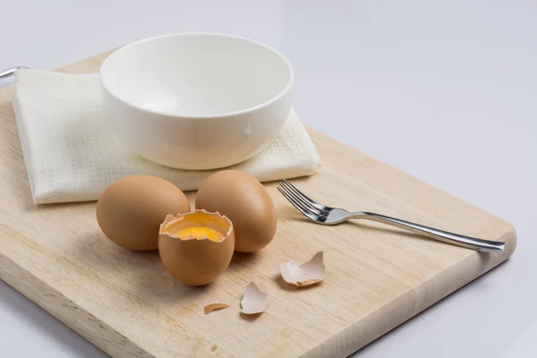 Raw eggs and cooking equipment — Stock Photo, Image