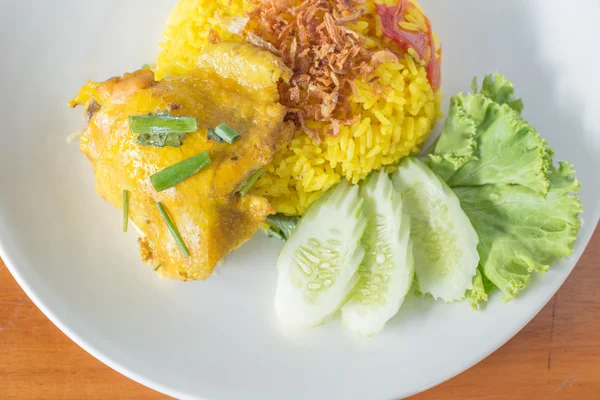 Biryani chicken yellow on white plate top view. — Stok Foto