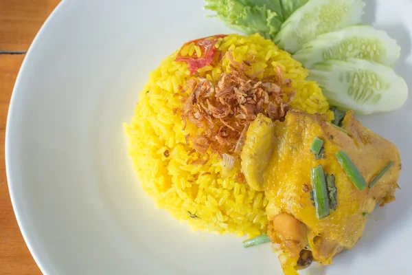 Biryani chicken yellow on white plate top view. — Stok Foto