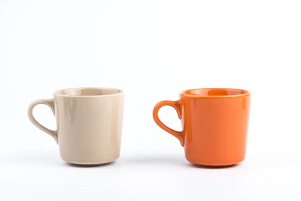 Copa naranja y taza marrón . — Foto de Stock