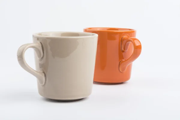 Orange Tasse und braune Tasse. — Stockfoto