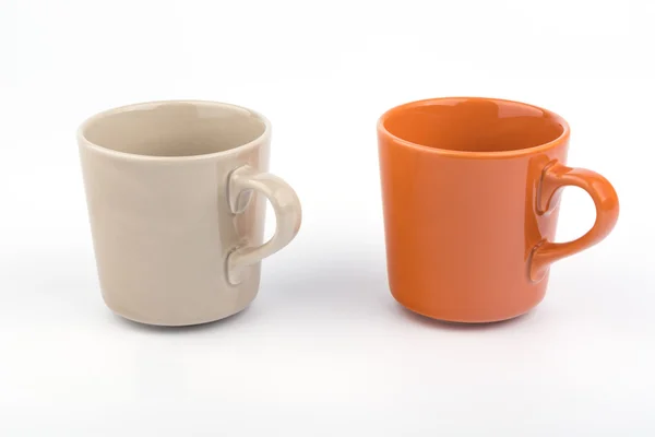 Copa naranja y taza marrón . — Foto de Stock