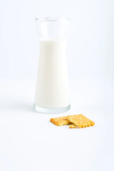 Biscuits and jug of milk — Stock Photo, Image